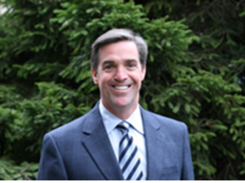 David Pieron pictures in front of a green background