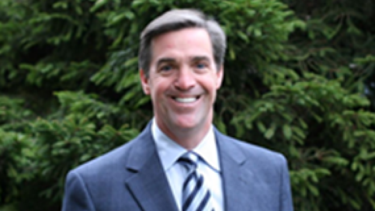David Pieron pictures in front of a green background